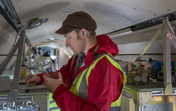 Inside the G-V: Scientist Eric Morgan with air samples taken above South America.